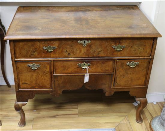 A George I and later feather banded walnut lowboy W.98cm